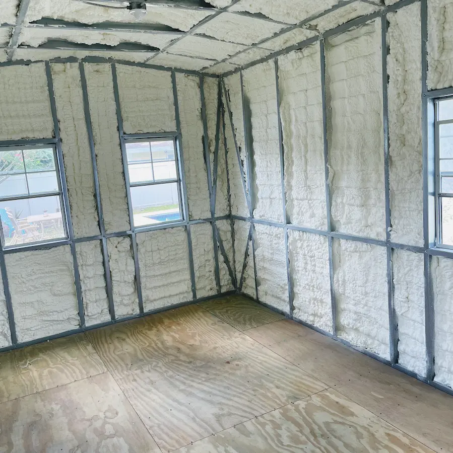 Closed-cell spray foam insulation applied to wall cavities in a residential project in Mantua